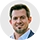 Portrait of Dmitriy_Psh, a SnapSort AI user, smiling with short hair and goatee in a blue suit outdoors